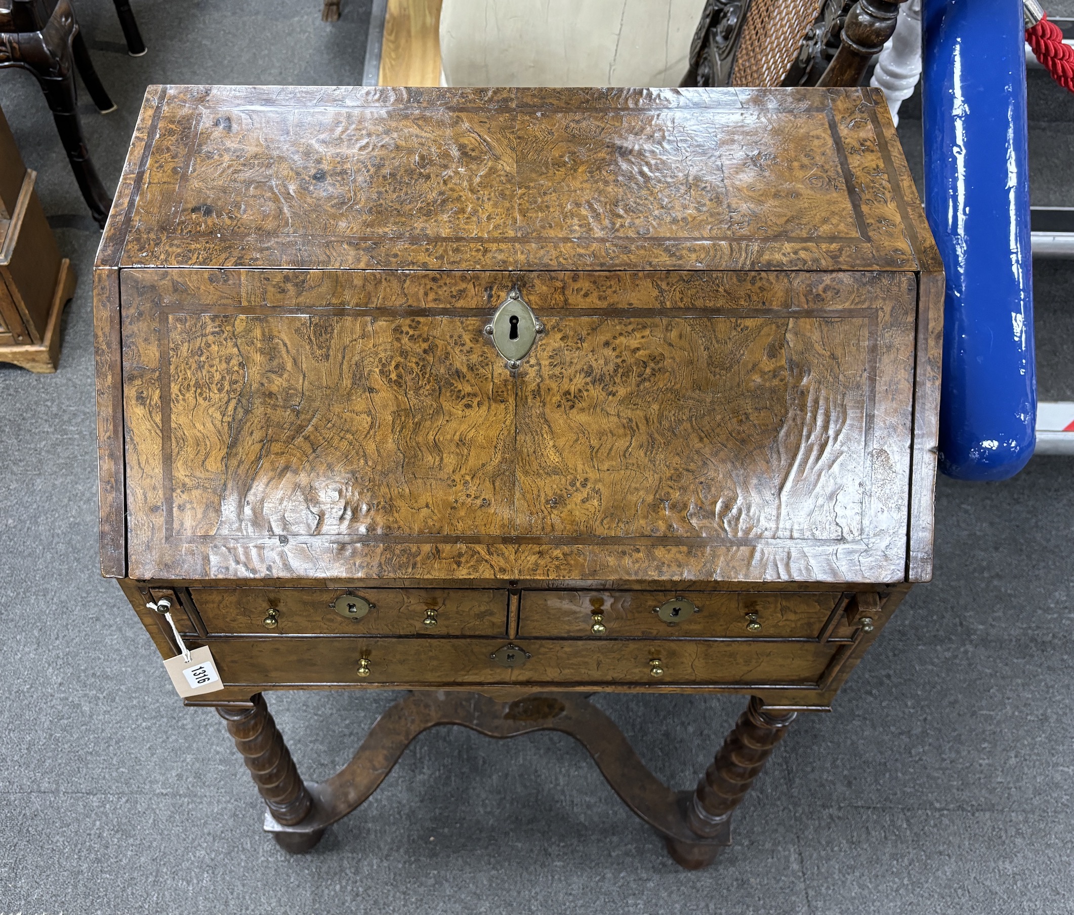 A banded burr walnut bureau on barley sugar twist supports, c.1800, width 56cm, height 94cm, Please note this lot attracts an additional import tax of 5% on the hammer price